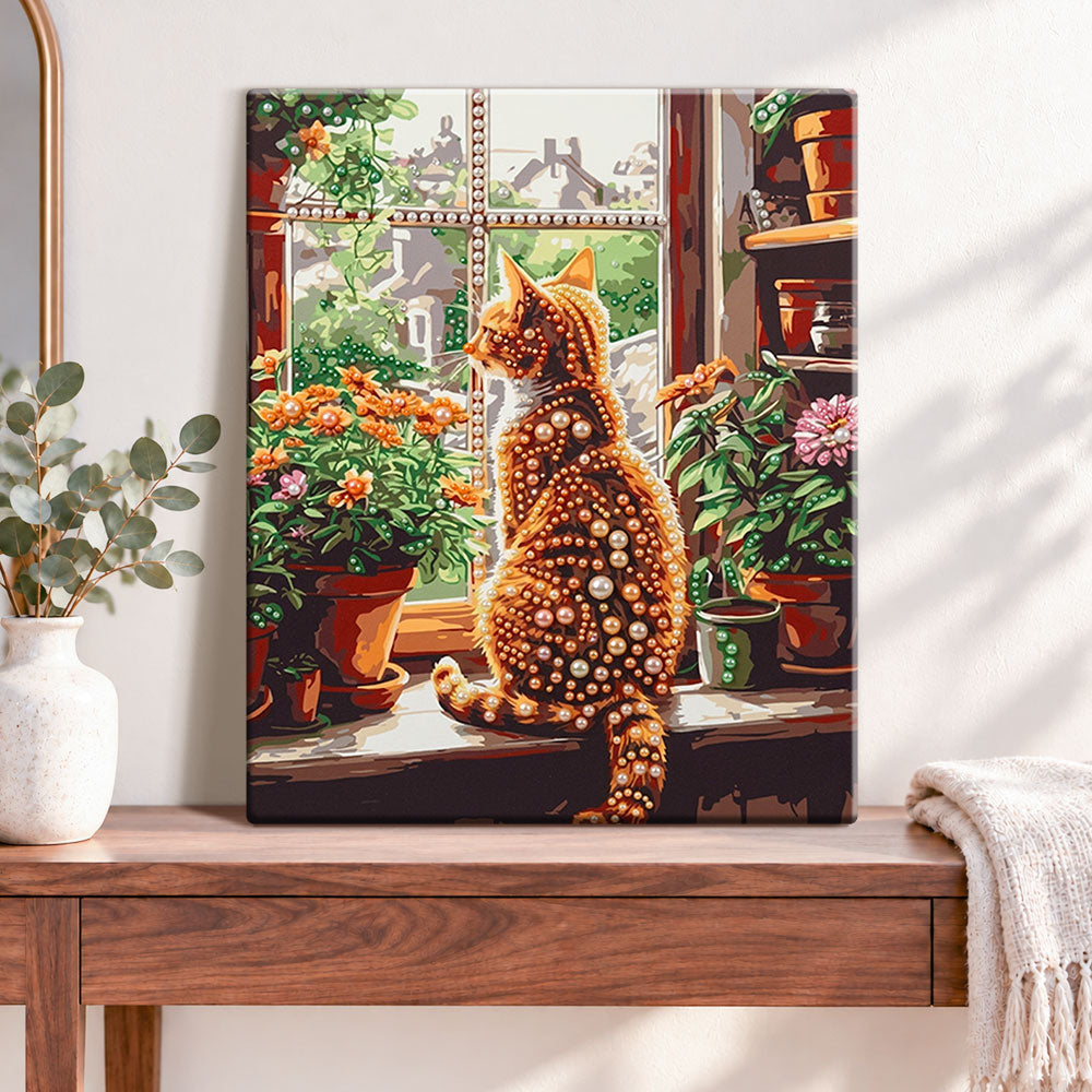 Finished windowside ginger cat pearl diamond painting artwork displayed as home decor