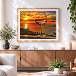 Finished wine glass by the sea at sunset cross stitch artwork displayed