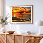Wine glass by the sea at sunset cross stitch artwork displayed on wall as home decor
