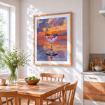 Wine glass reflecting sunset clouds cross stitch artwork displayed on wall as home decor