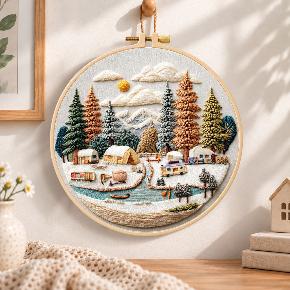 Winter camping valley embroidery hoop wall art displayed as warm and cosy handmade home decor