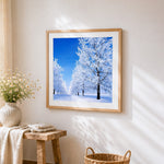 Winter frosted tree avenue cross stitch artwork displayed on wall as home decor