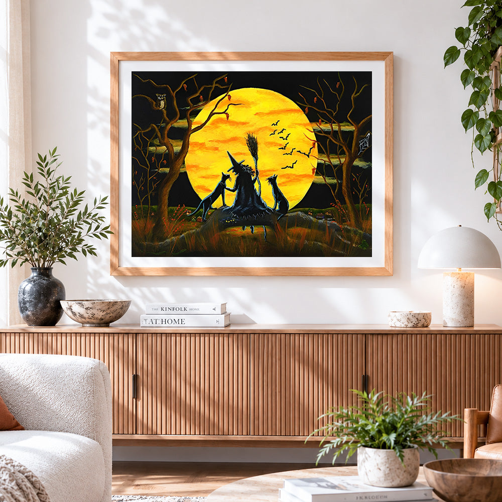 Finished witch and black cats silhouette cross stitch artwork displayed