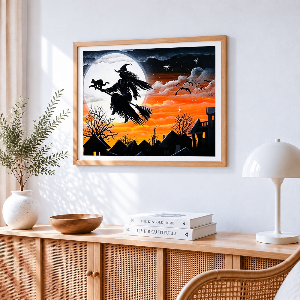 Witch flying on broomstick across the moon cross stitch artwork displayed on wall as home decor