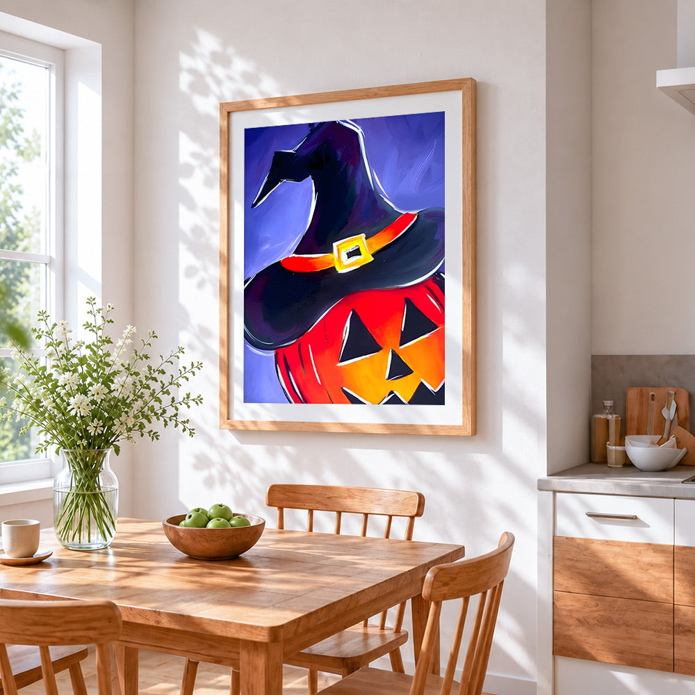 Witch hat on glowing pumpkin cross stitch artwork displayed on wall as home decor