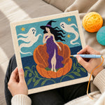 Creating handmade witch in giant pumpkin punch needle artwork