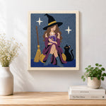 Finished witch reading magic book with cat artwork displayed on a wall