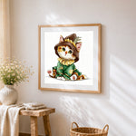 Wizard cat in hat cross stitch artwork displayed on wall as home decor
