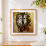 Finished wolf portrait with autumn leaves cross stitch artwork displayed