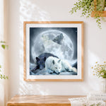 Finished wolves howling at the moon cross stitch artwork displayed