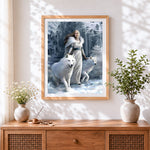 Finished woman and white wolves in a snowy forest cross stitch artwork displayed