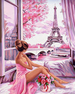 Woman by window looking at eiffel tower cross stitch kit for beginners