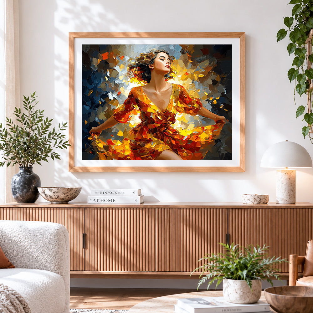 Finished woman dancing in autumn leaves cross stitch artwork displayed