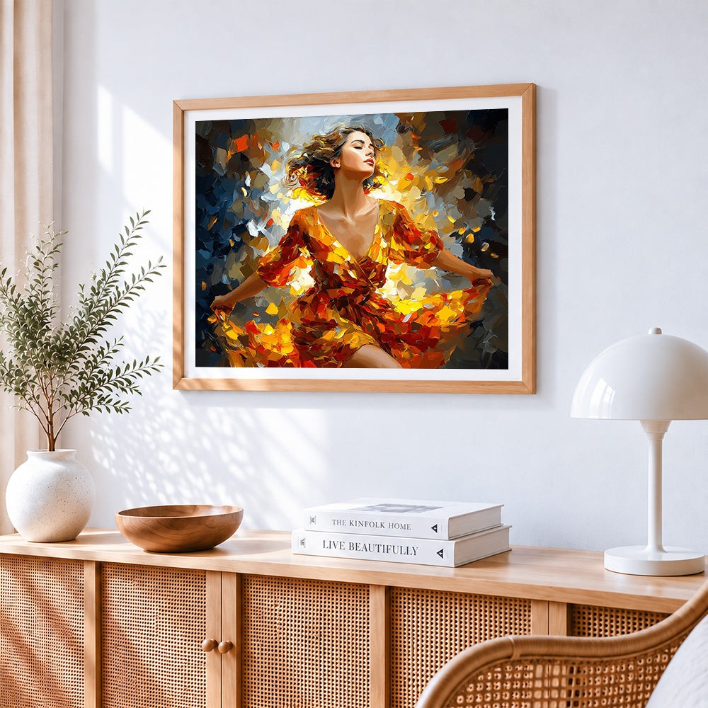 Woman dancing in autumn leaves cross stitch artwork displayed on wall as home decor