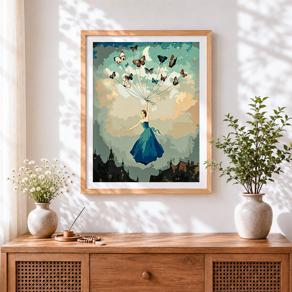 Finished woman flying with butterflies cross stitch artwork displayed