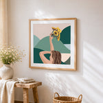 Woman holding sunflowers cross stitch artwork displayed on wall as home decor