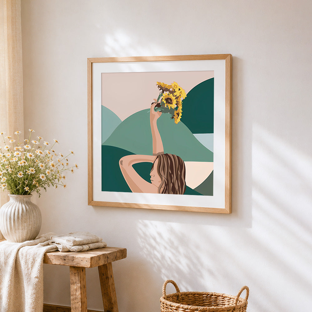 Woman holding sunflowers cross stitch artwork displayed on wall as home decor