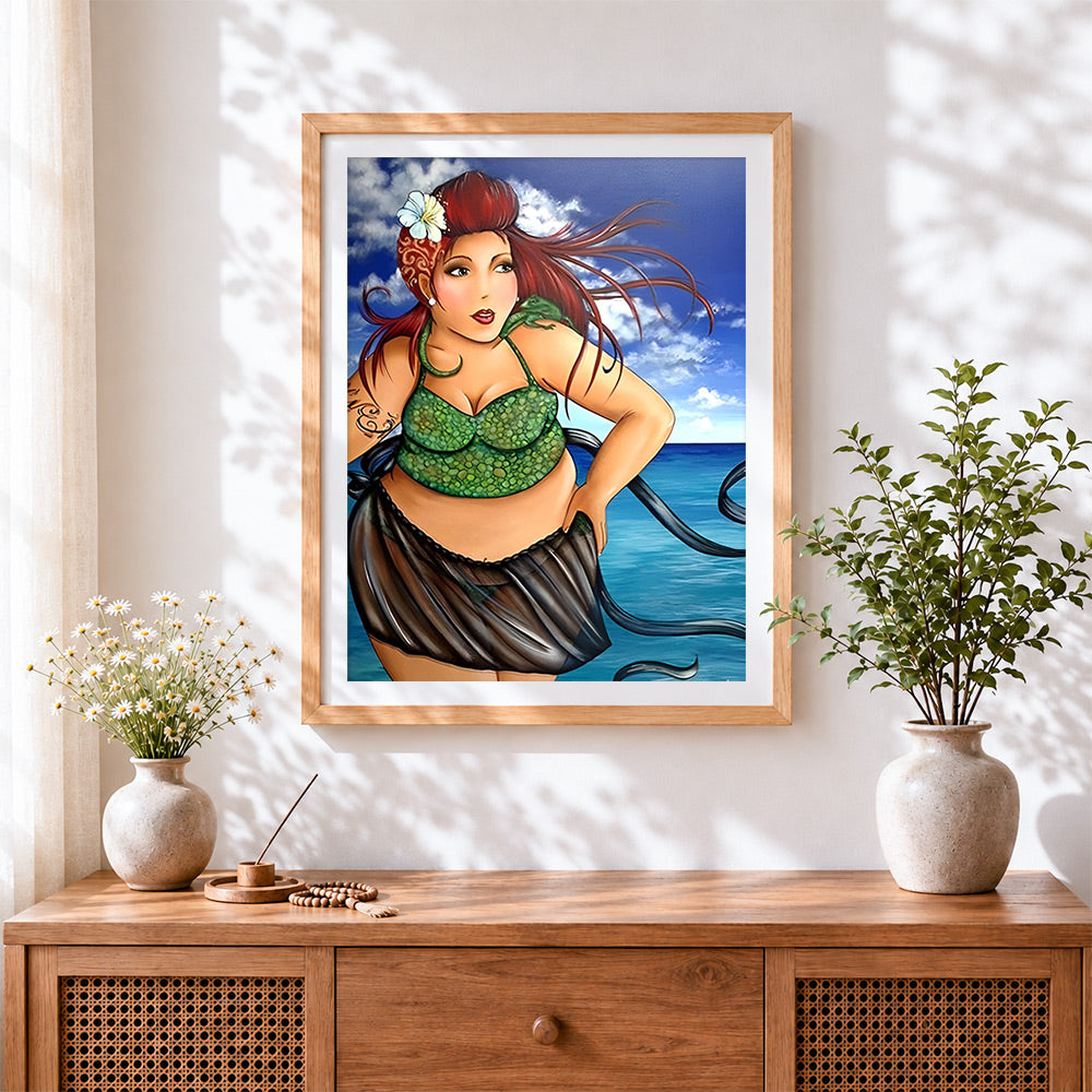 Finished woman in green bikini cross stitch artwork displayed