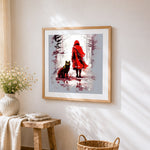 Woman in red coat and a wolf cross stitch artwork displayed on wall as home decor