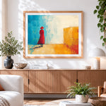 Finished woman in red coat cross stitch artwork displayed