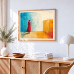 Woman in red coat cross stitch artwork displayed on wall as home decor
