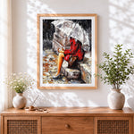 Finished woman in red coat in the rain cross stitch artwork displayed
