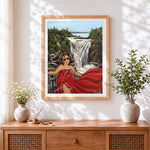 Finished woman in red dress by waterfall cross stitch artwork displayed