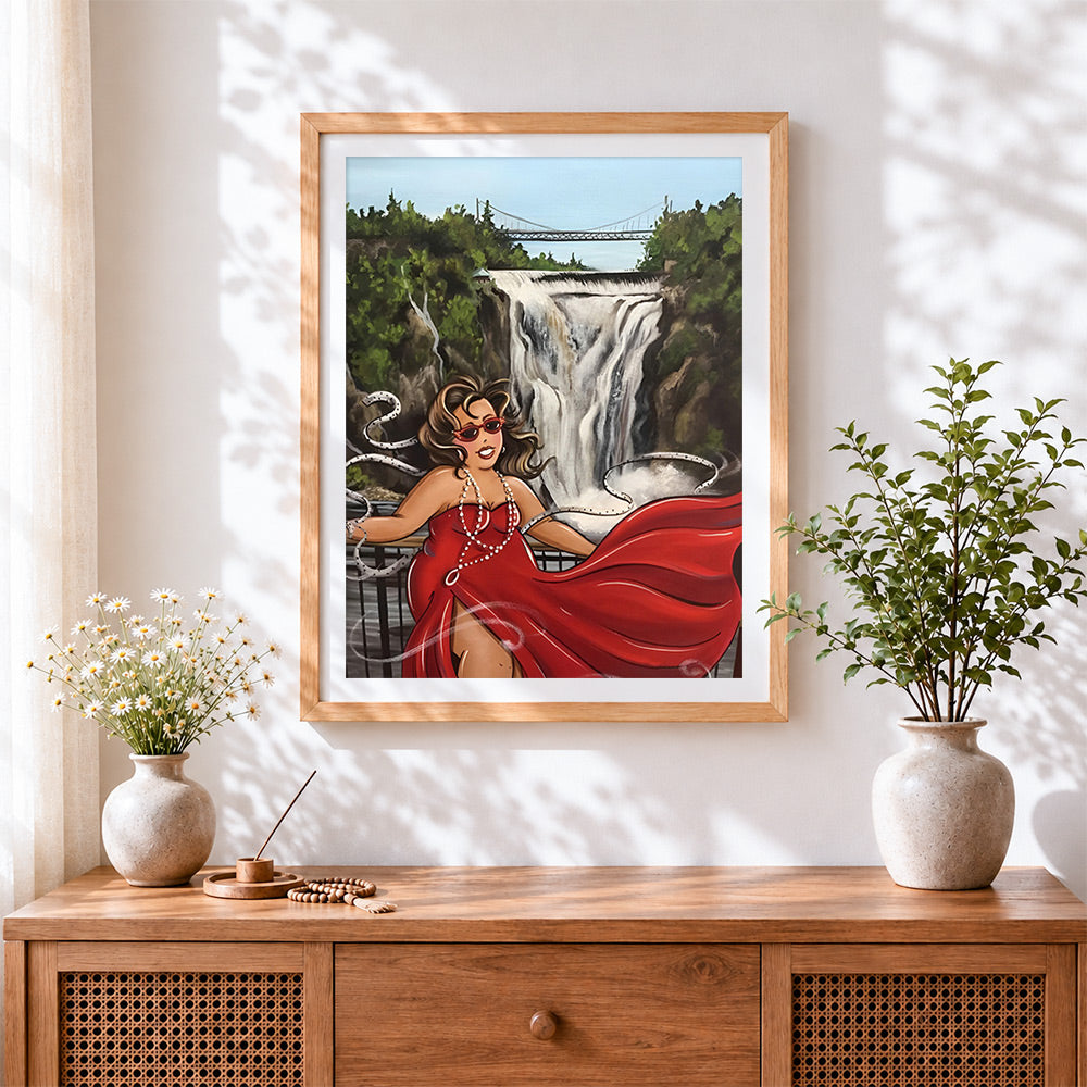 Finished woman in red dress by waterfall cross stitch artwork displayed
