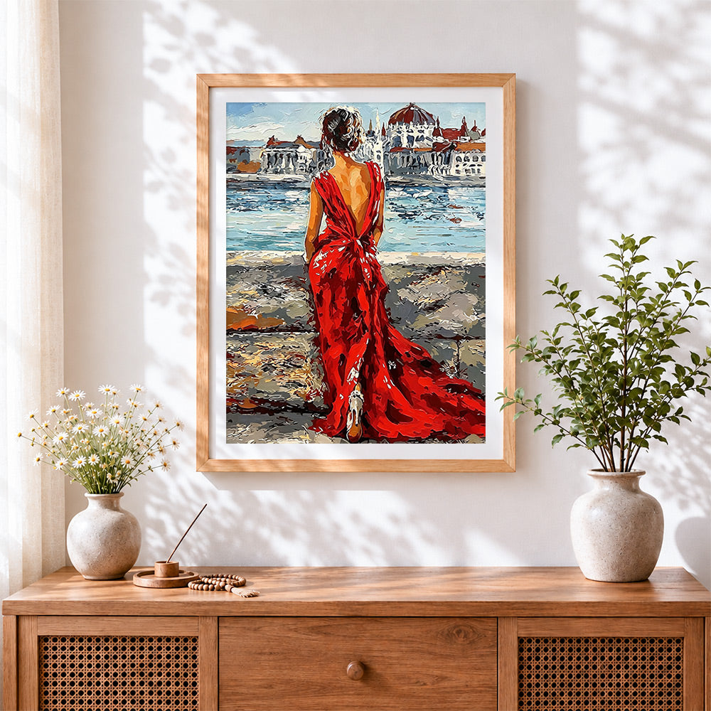 Finished woman in red dress in venice cross stitch artwork displayed