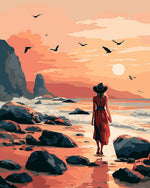 Woman in red dress walking on a beach cross stitch kit for beginners
