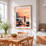 Woman in red dress walking on a beach cross stitch artwork displayed on wall as home decor