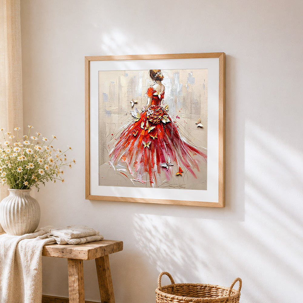 Woman in red dress with butterflies cross stitch artwork displayed on wall as home decor