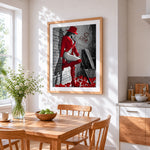 Woman in red hat and boots cross stitch artwork displayed on wall as home decor