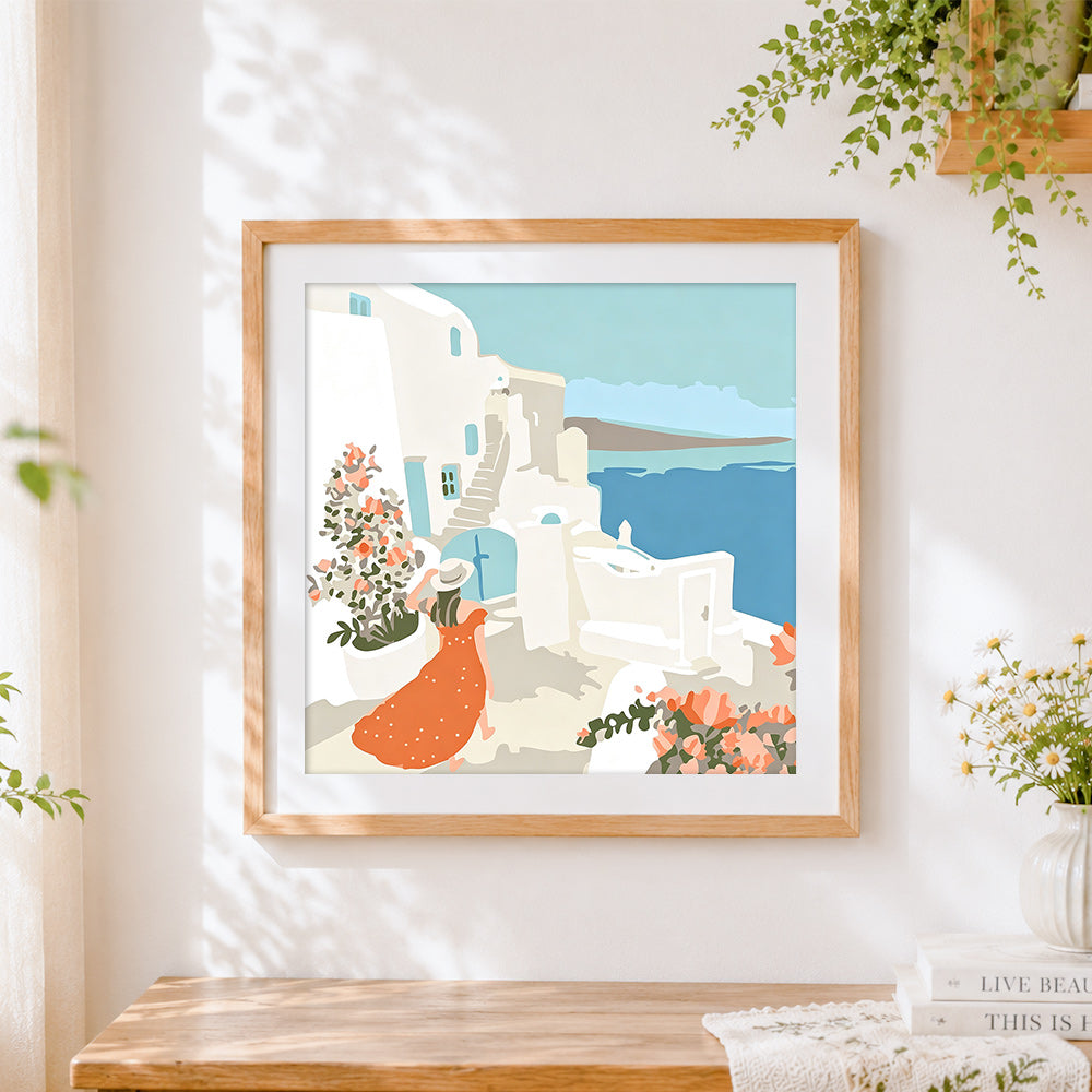 Finished woman in santorini cross stitch artwork displayed
