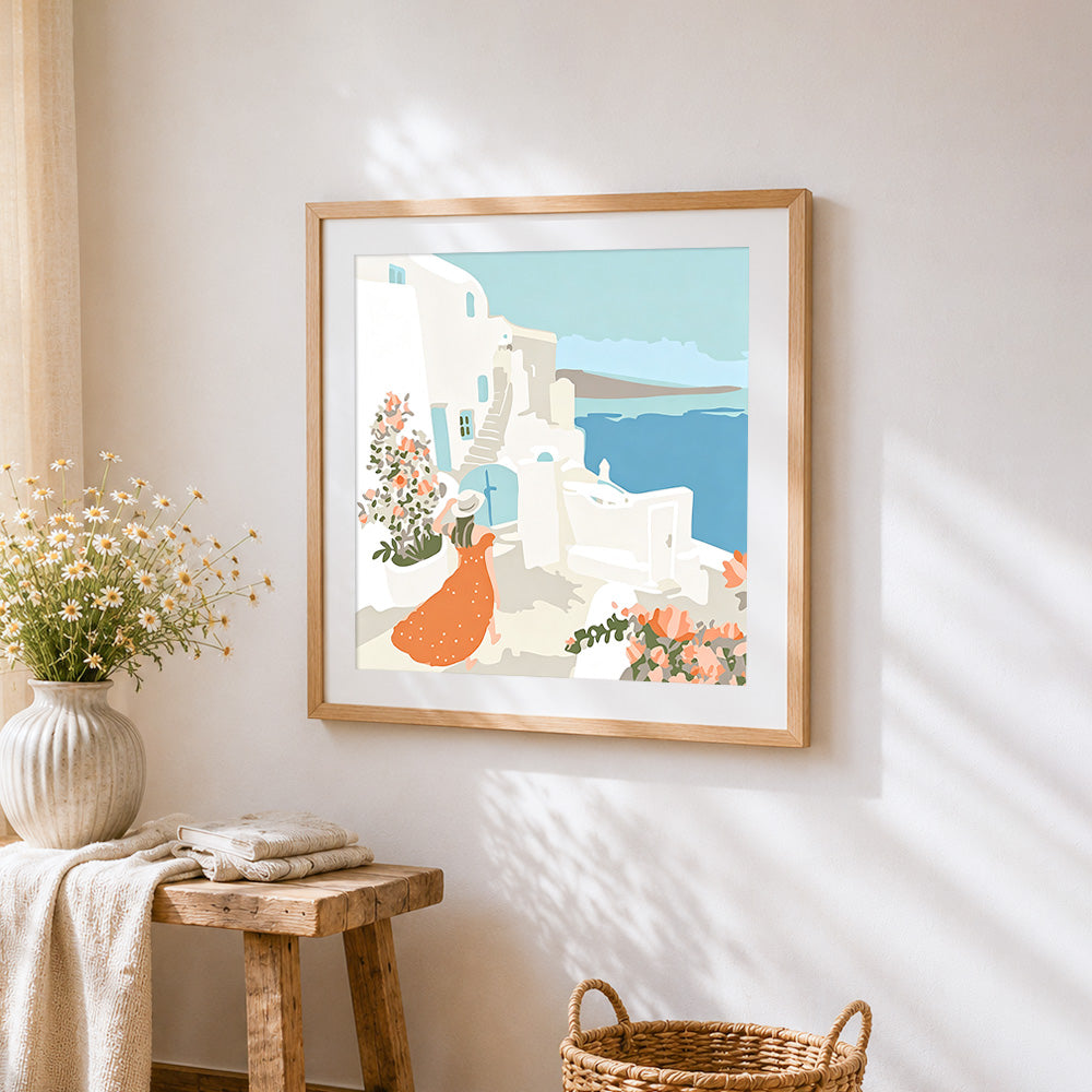 Woman in santorini cross stitch artwork displayed on wall as home decor