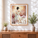 Finished woman in white dress cross stitch artwork displayed