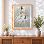 Finished woman in white dress with flowers and butterflies cross stitch artwork displayed