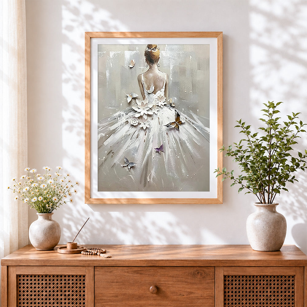 Finished woman in white dress with flowers and butterflies cross stitch artwork displayed