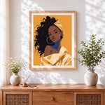 Finished woman in yellow headwrap cross stitch artwork displayed