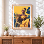 Finished woman in yellow with leopard cross stitch artwork displayed