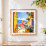 Finished woman on a mediterranean balcony cross stitch artwork displayed
