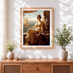Finished woman on balcony by the sea cross stitch artwork displayed