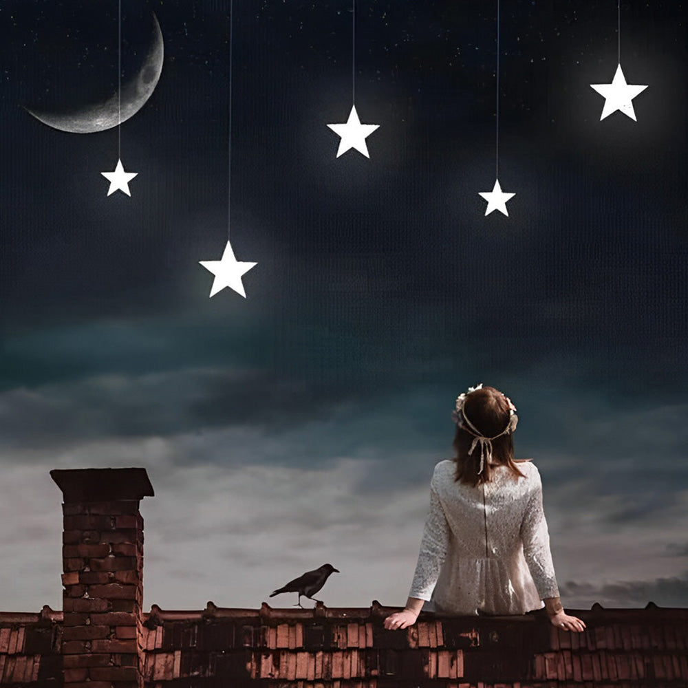 Woman on rooftop with hanging stars cross stitch kit for beginners