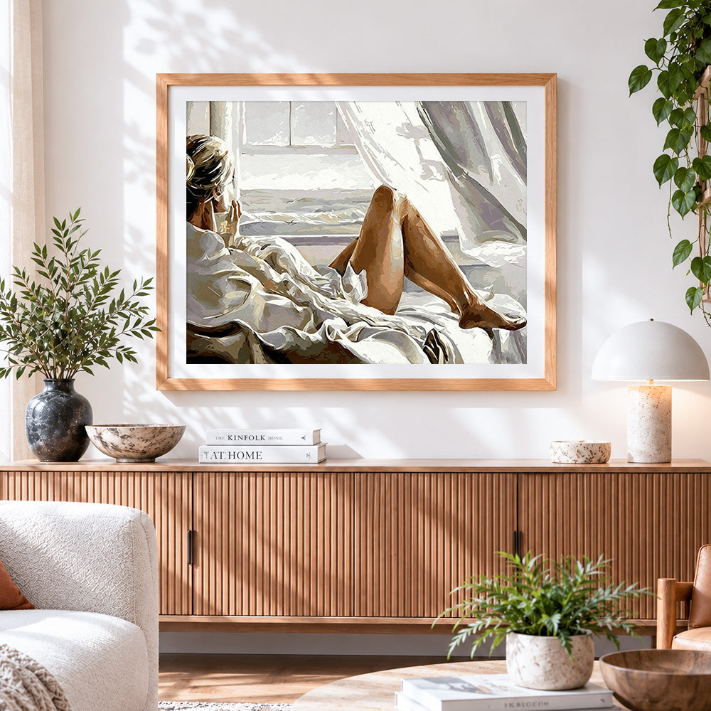 Finished woman relaxing by the window paint by numbers artwork displayed as home decor