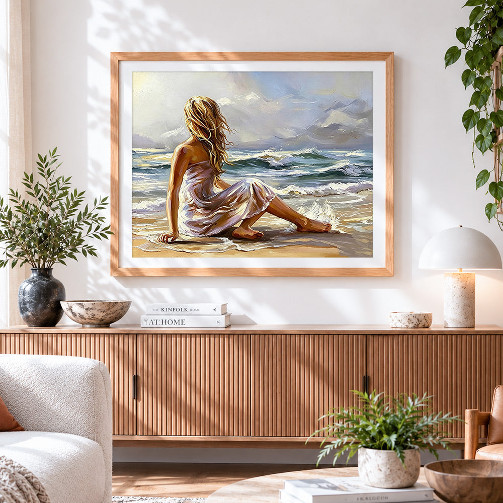 Finished woman sitting by the sea paint by numbers artwork displayed as home decor