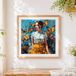 Finished woman surrounded by yellow butterflies cross stitch artwork displayed