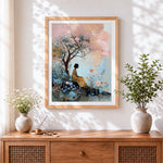 Finished woman under blossom tree cross stitch artwork displayed
