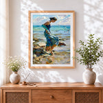 Finished woman walking on the rocks cross stitch artwork displayed
