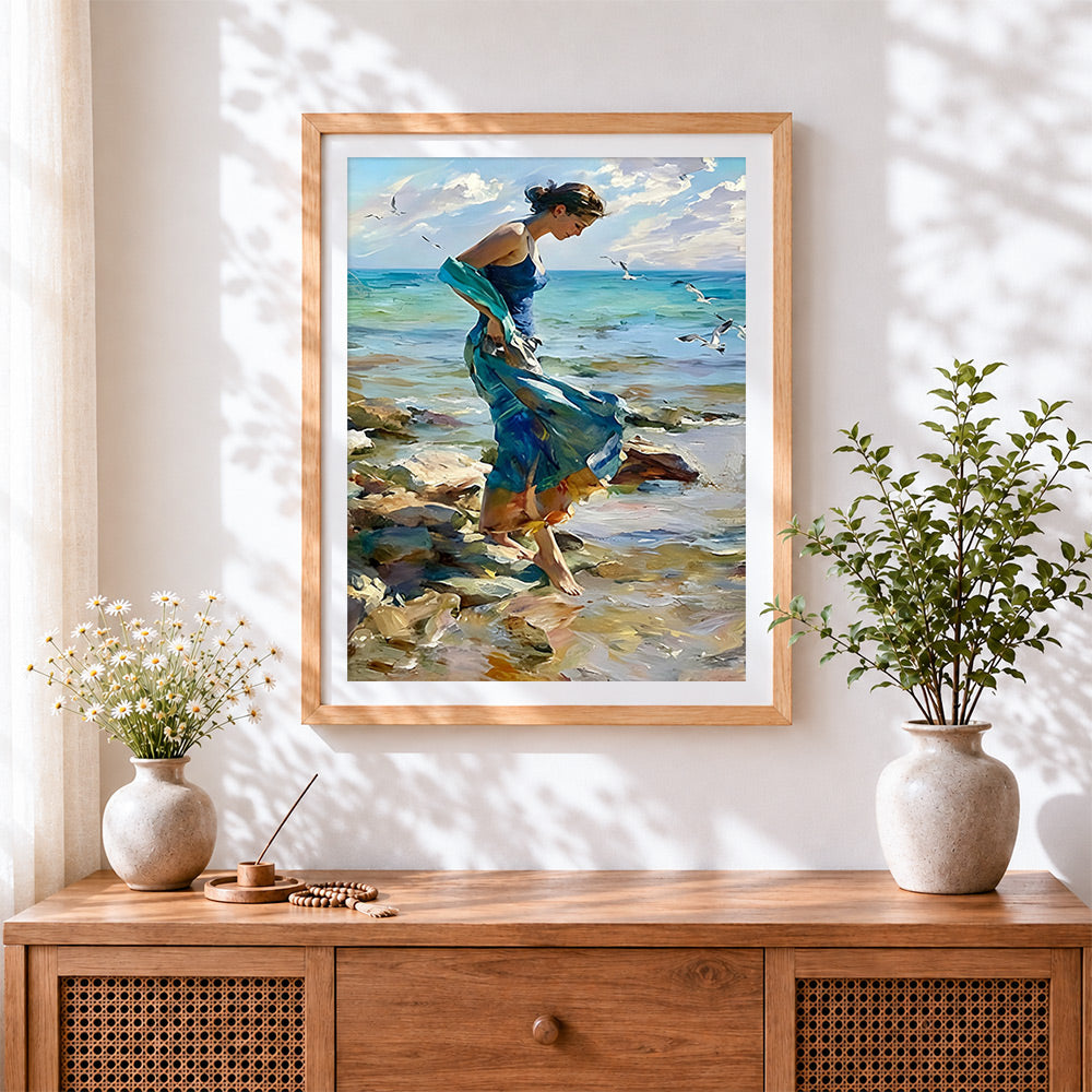 Finished woman walking on the rocks cross stitch artwork displayed
