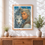 Finished woman, white tiger and snowy castle cross stitch artwork displayed